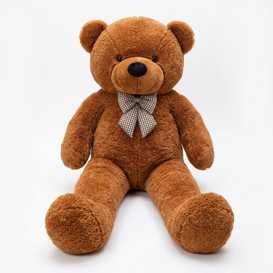 A brown plush teddy bear sitting upright against a clean white background, wearing a small checkered bow tie.