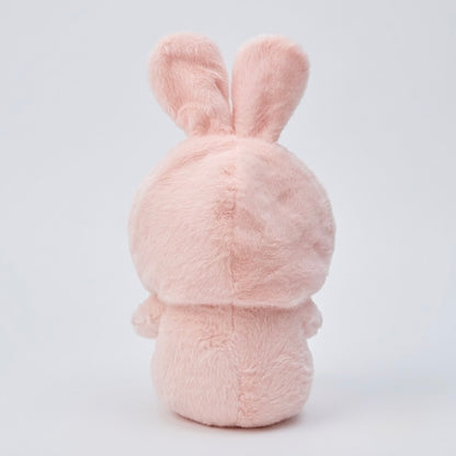 A light pink plush bunny toy shown from the back, featuring soft, fuzzy texture and upright ears, set against a clean white studio background.