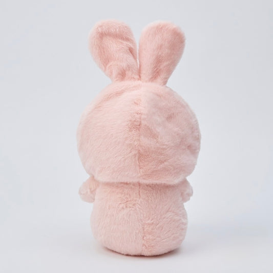 A light pink plush bunny toy shown from the back, featuring soft, fuzzy texture and upright ears, set against a clean white studio background.
