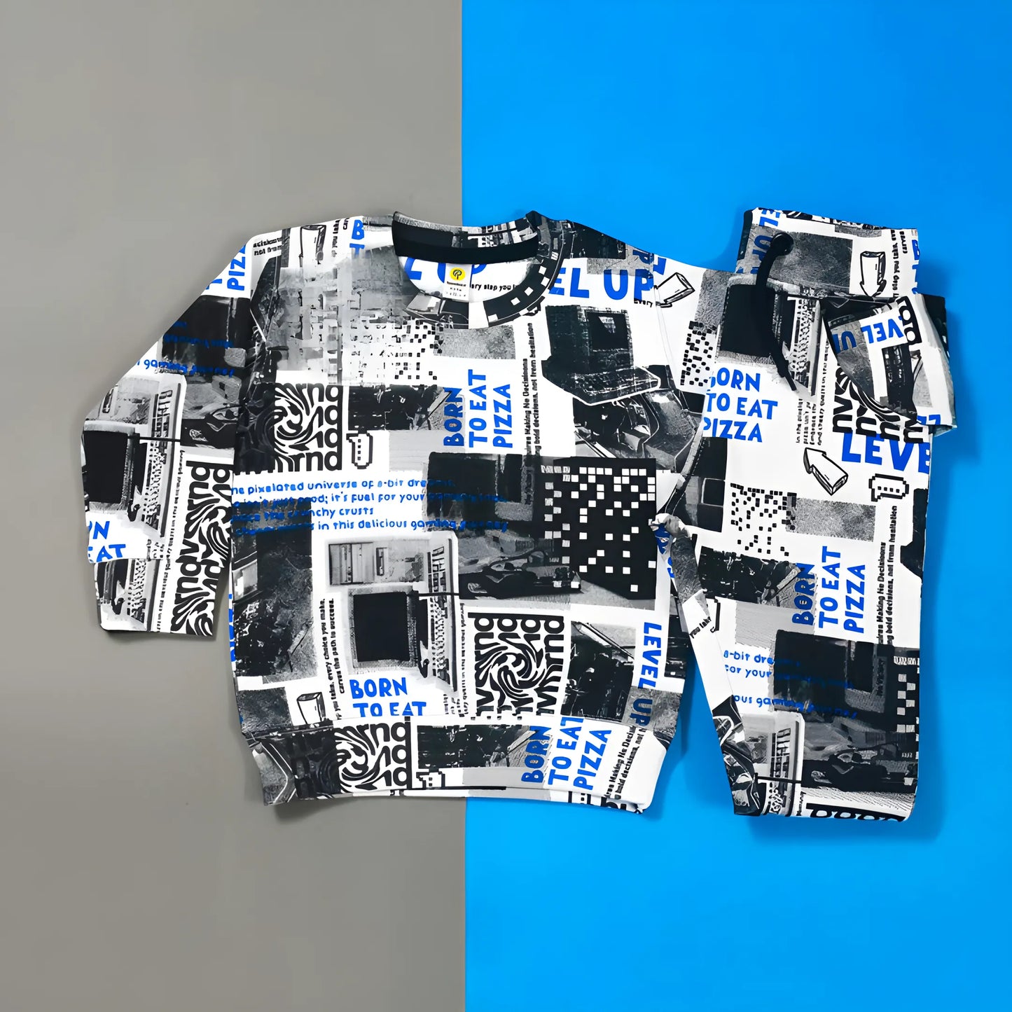 Close‑up of all‑over graphic print on white tracksuit