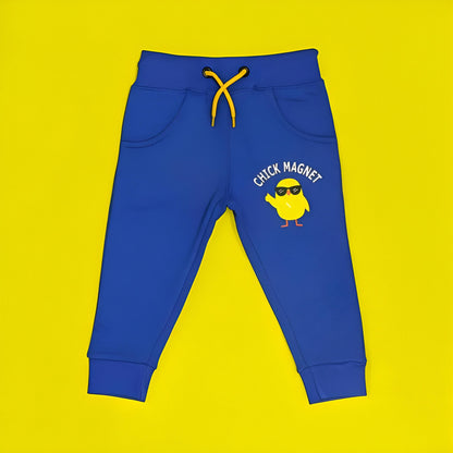 Blue children's jogger pants with a yellow chick graphic and 'Chick Magnet' text on a yellow background