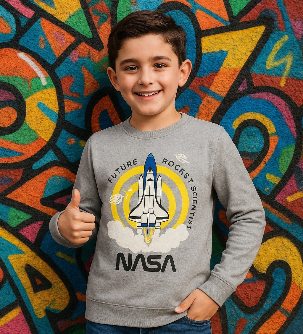 Child wearing a NASA sweatshirt with a colorful background