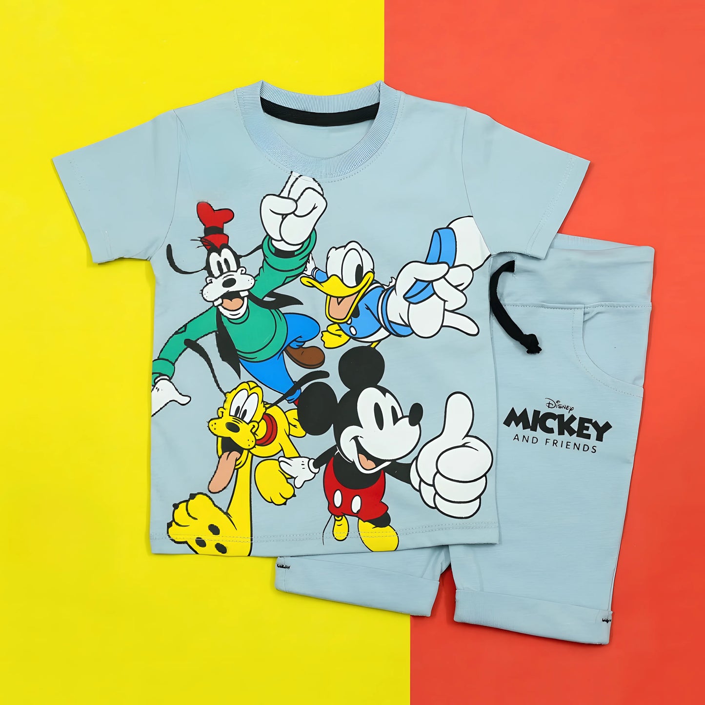 Children's pajama set with Mickey and Friends characters on a yellow and red background