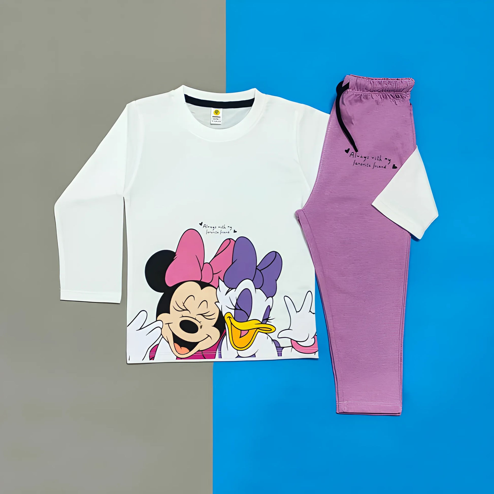 Children's pajama set with cartoon character on shirt against a blue and gray background