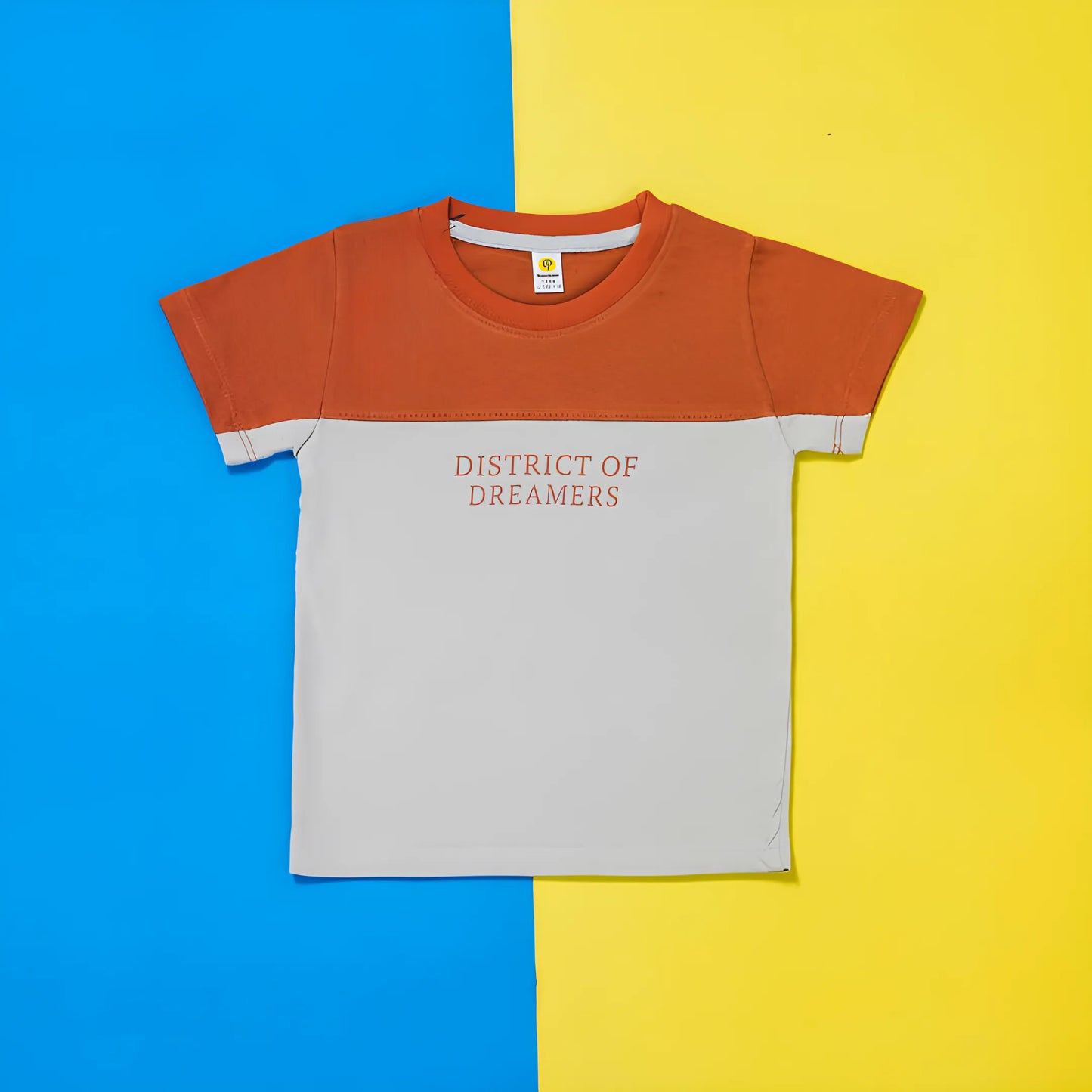 Children's t-shirt with 'District of Dreamers' text on a blue and yellow background