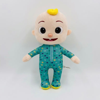 A Cocomice plush toy doll wearing a teal blue and yellow patterned footie pajama, standing against a plain white background.