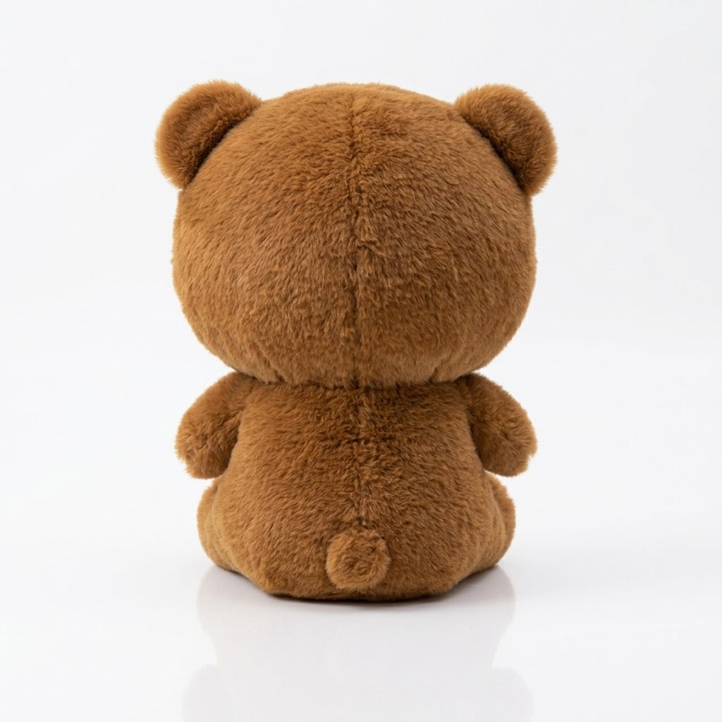 A brown plush teddy bear toy shown from the back, sitting on a clean white reflective surface.