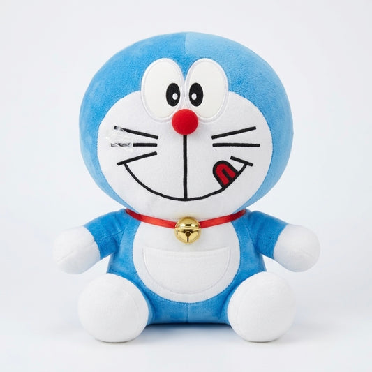 A blue and white plush toy of Doraemon with a red bell collar, photographed against a clean white background.