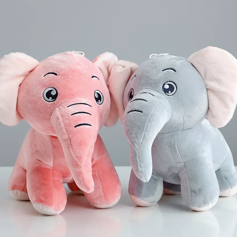 Two plush elephants, one pink and one gray, on a white surface with a gray background.
