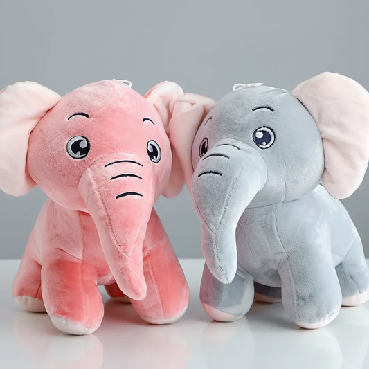 Two plush elephants, one pink and one gray, on a white surface with a gray background.