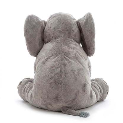 A gray plush elephant toy shown from the back, sitting with its ears wide and tail hanging down, photographed on a clean white background.