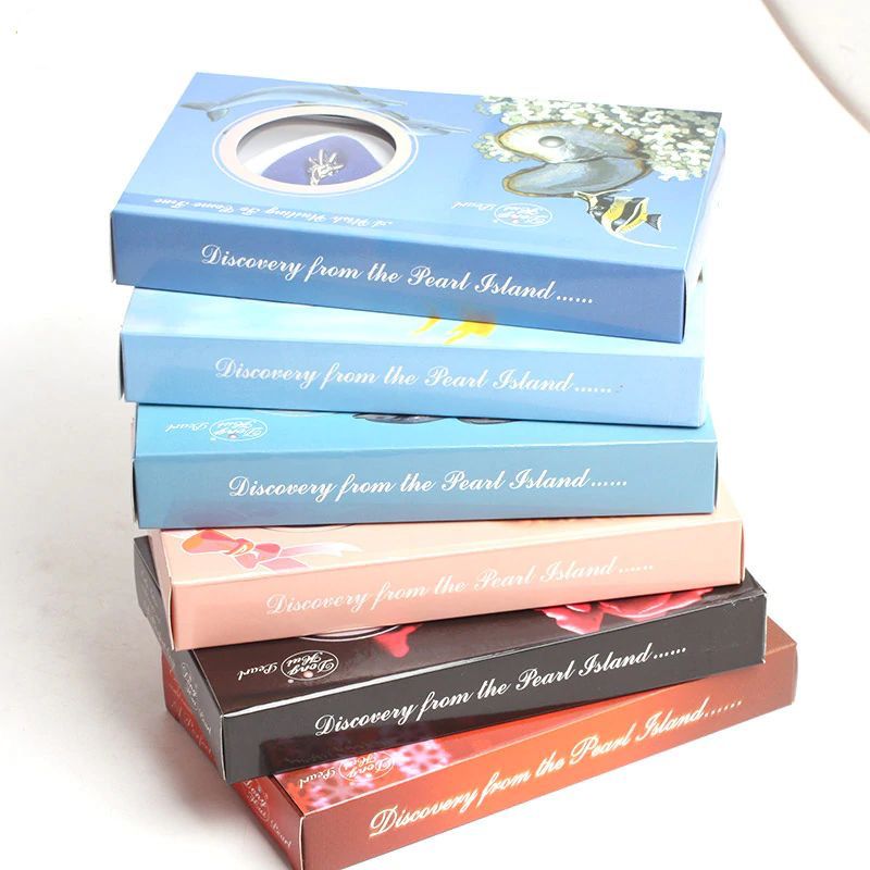Stack of books titled 'Discovery from the Pearl Island' on a white background