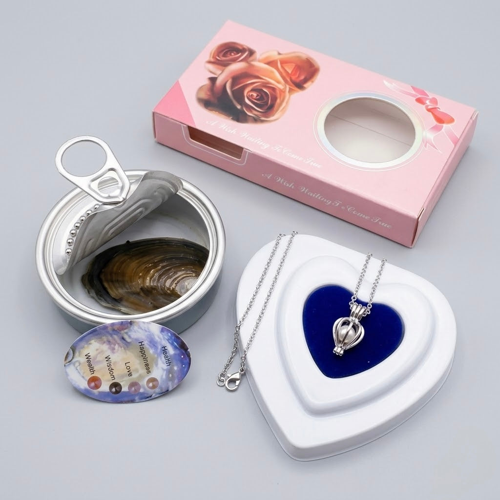 A gift set containing a silver heart-shaped pendant necklace on a chain, a white heart-shaped jewelry box with a blue velvet insert, an open silver tin with a clam inside, and a small oval blue-and-white charm, arranged on a light gray background with a pink rose-patterned gift box behind them.