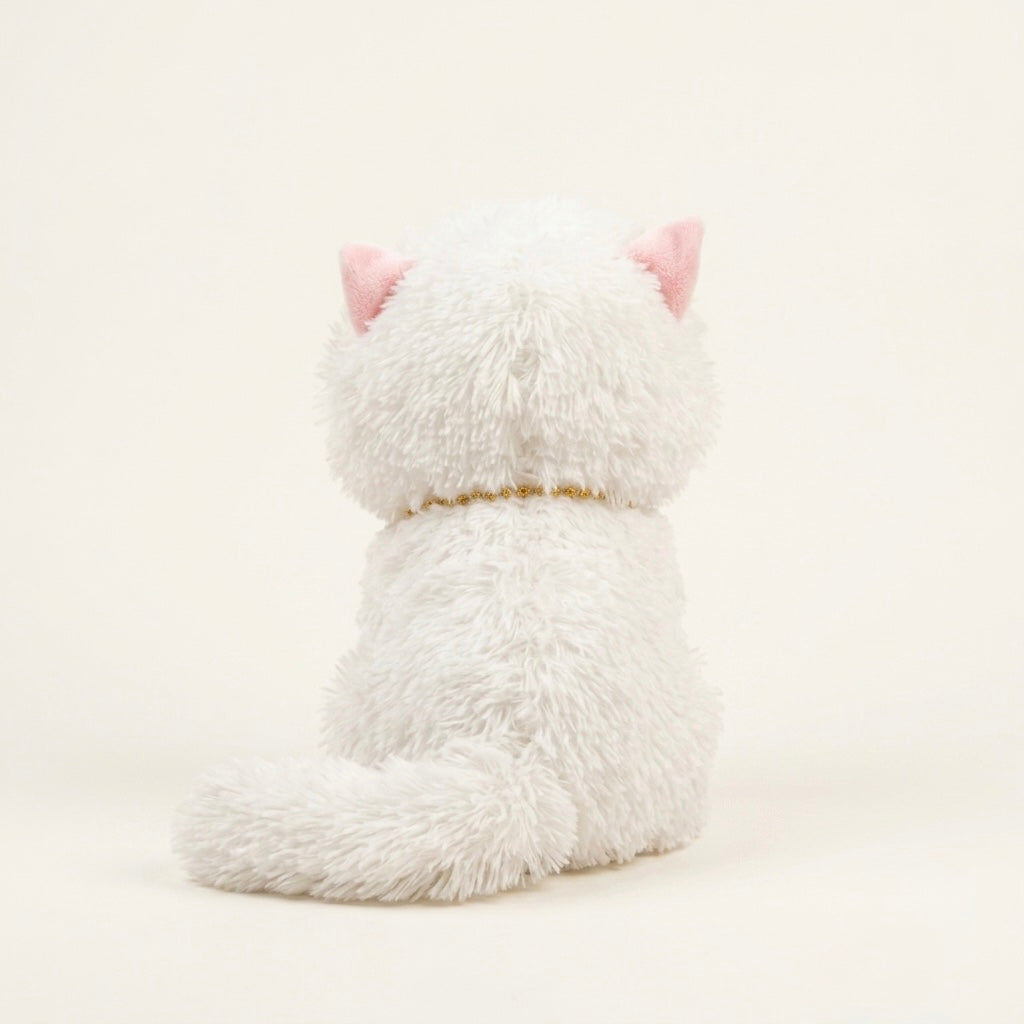 A white fluffy plush cat toy shown from the back, featuring pink inner ears and a thin gold collar, set against a plain cream background.