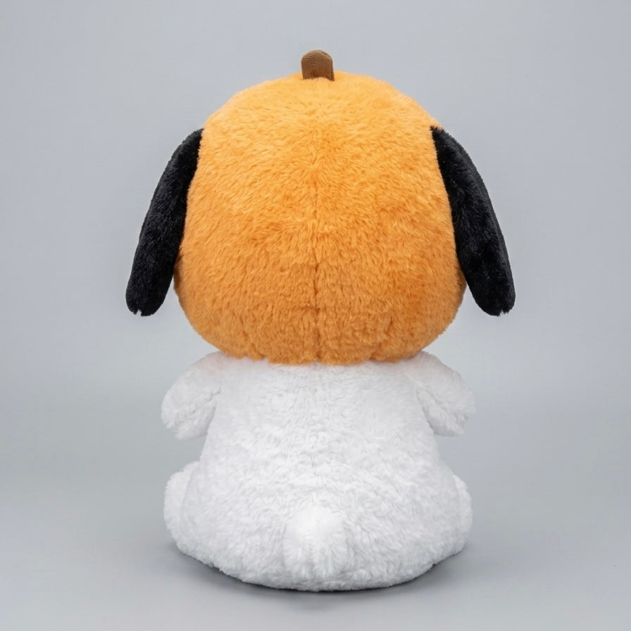 A plush toy dog shown from the back, featuring a bright orange head with black floppy ears, a small brown nose, and a fluffy white body, photographed on a light gray studio background.