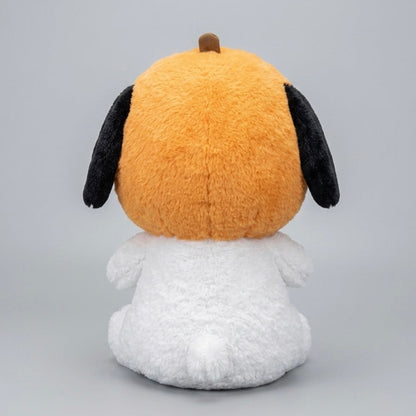 A plush toy dog shown from the back, featuring a bright orange head with black floppy ears, a small brown nose, and a fluffy white body, photographed on a light gray studio background.