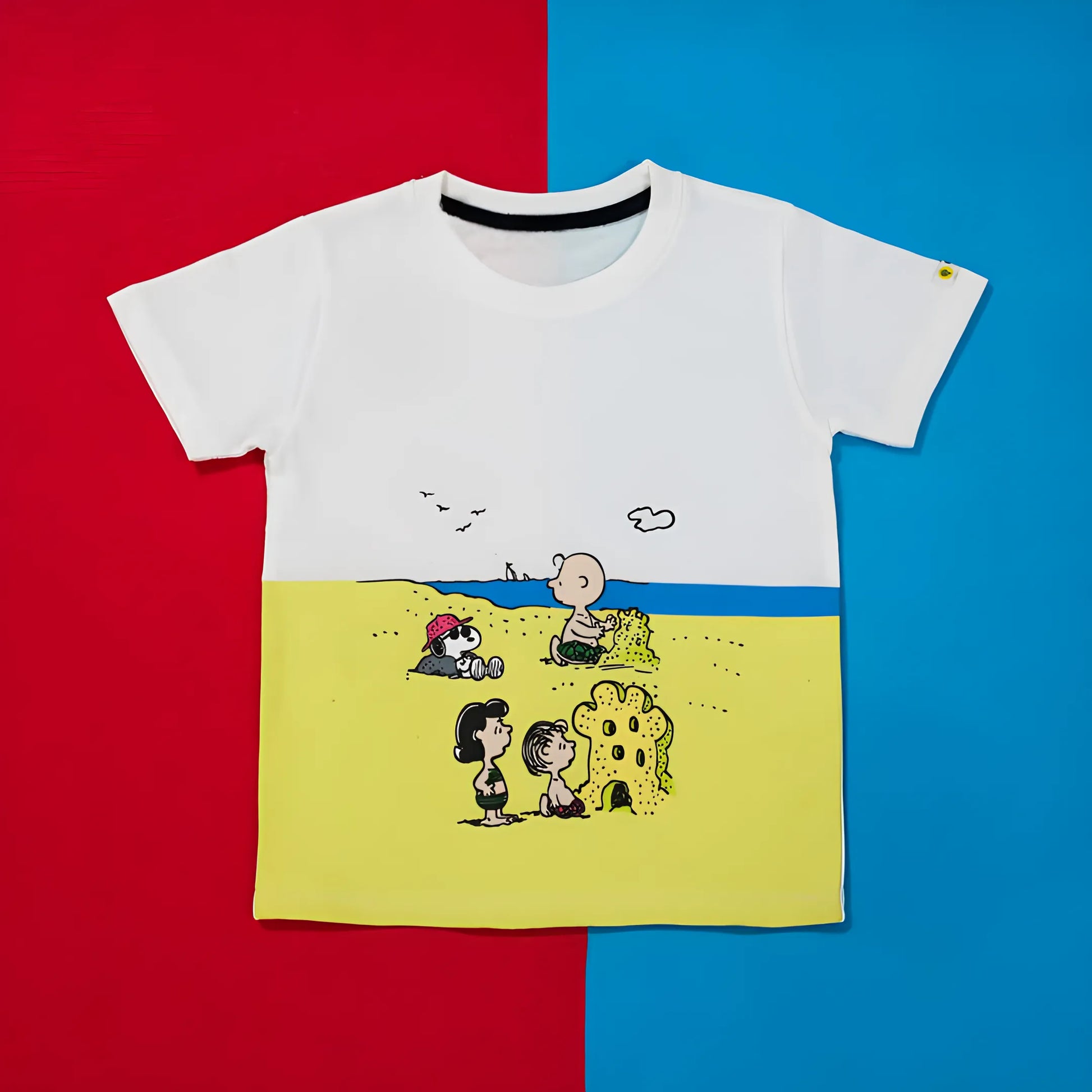 White t-shirt with cartoon design on a red and blue background