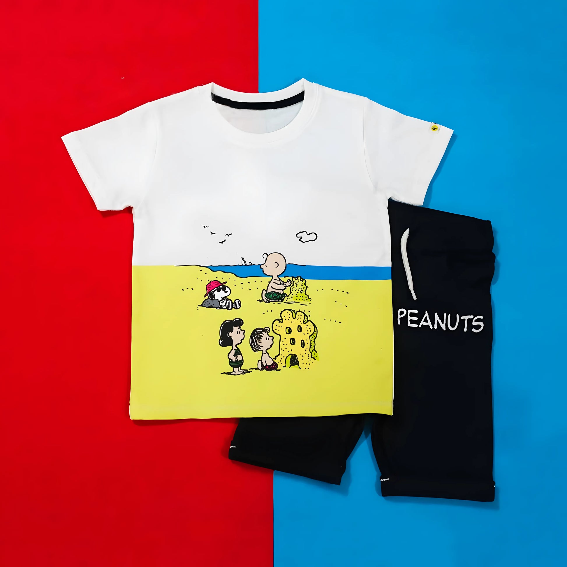 White t-shirt with cartoon design and black pouch on a red and blue background