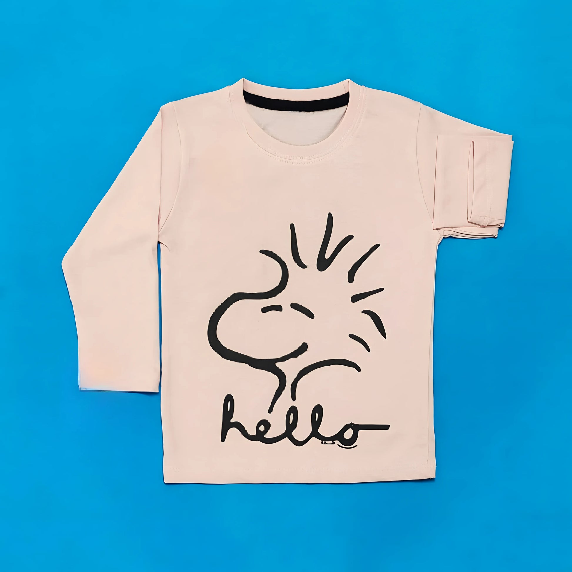Beige t-shirt with black dog illustration and 'hello' text on a blue background