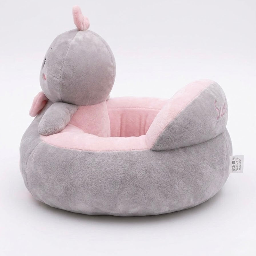 A plush baby pet bed shaped like a cartoon animal head, featuring a soft gray exterior and a pink interior, photographed on a clean white background.